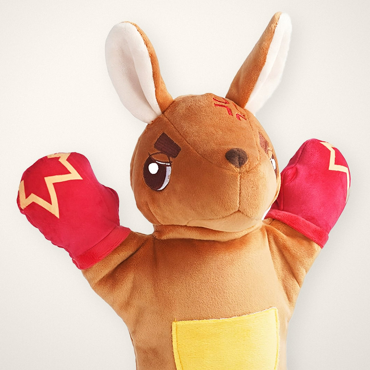 Close-up of the Roo's face and red boxing gloves